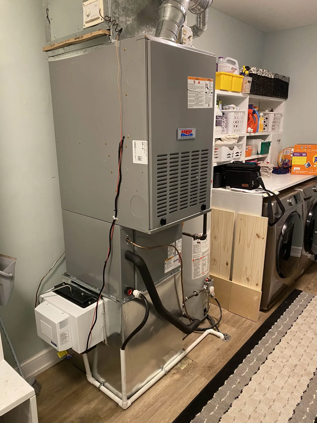 people sitting down near table with assorted laptop computers